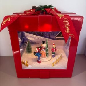 Caja de regalo musical con luz y movimiento